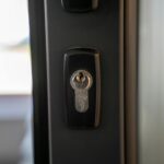 modern smart lock installed on front door
