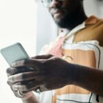 person using smartphone with privacy settings